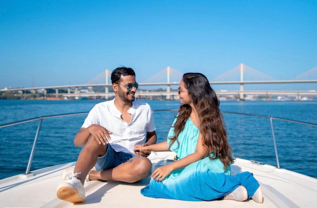 Celebrating love with champagne toast on a luxurious yacht deck.