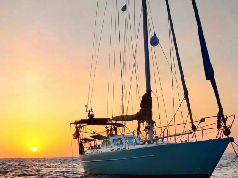 Sail into luxury on a sunset yacht cruise in Mumbai, India. Experience the beauty of the city skyline bathed in golden light. (Luxury travel India)